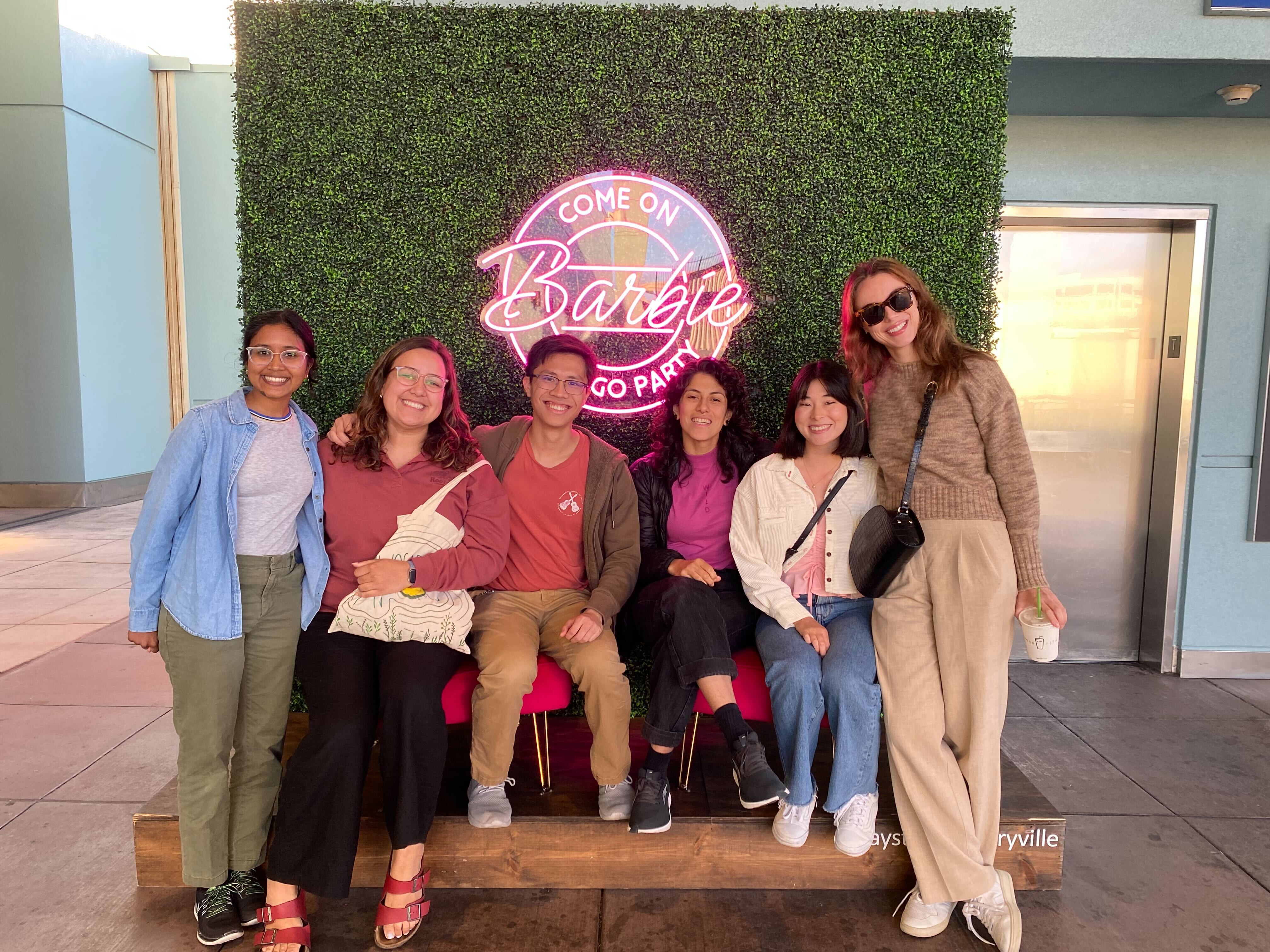 Ananya, Nicole, Kevin, Yakira, Elisa, and Caseysimone in front of a sign that says come on Barbie go party